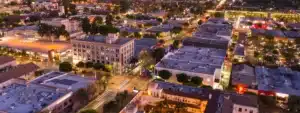 Downtown Fullerton, California at night, featuring historic buildings and vibrant lights—ideal for a law firm supporting tenant rights in a busy residential area.