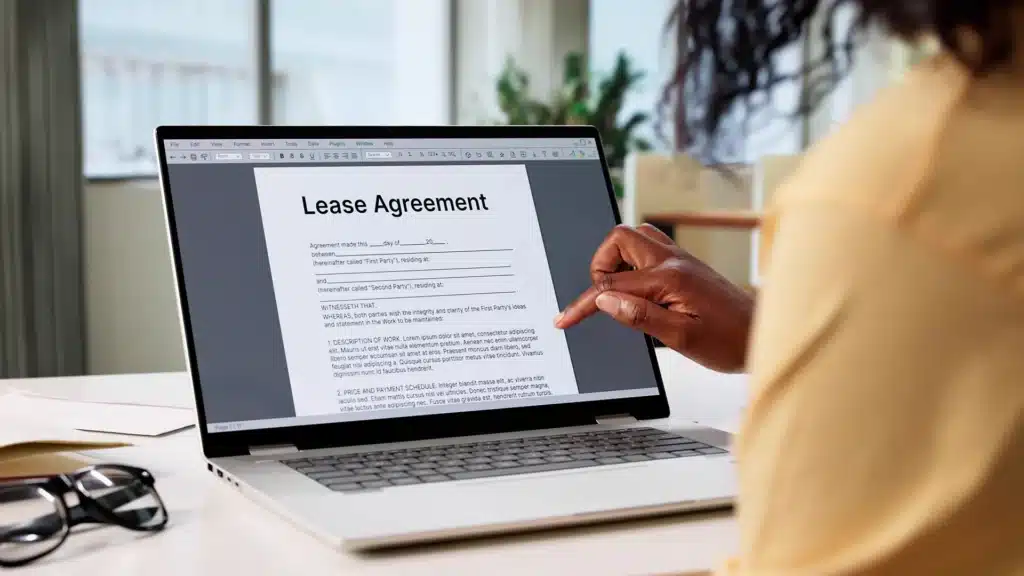 Close-up of a California lease contract with highlighted clauses about early termination and tenant rights.