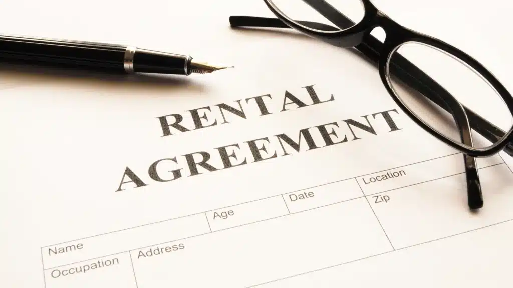Landlord-tenant attorney reviewing a lease with a tenant.