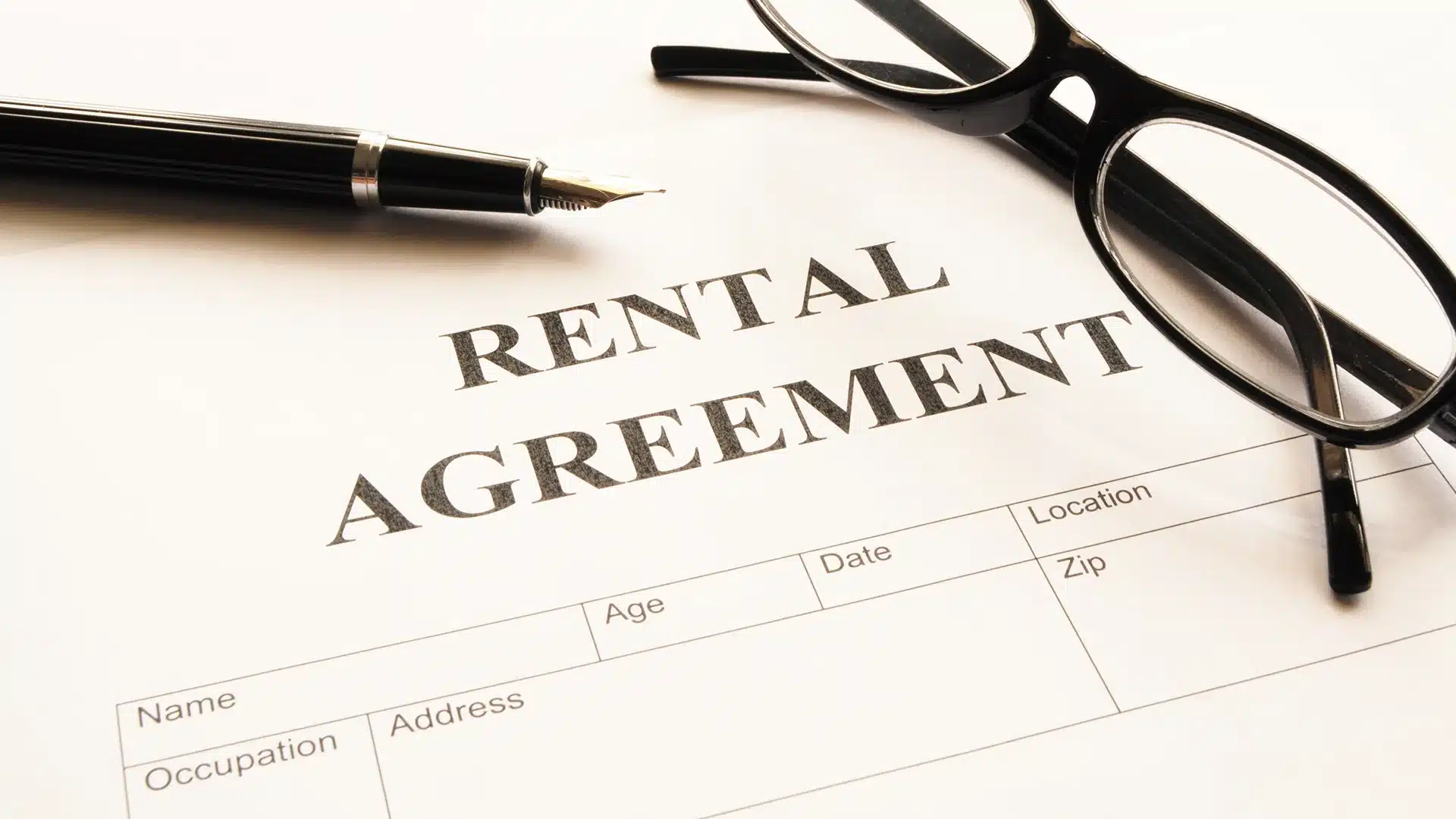 Landlord-tenant attorney reviewing a lease with a tenant.