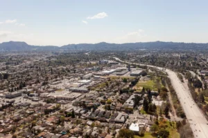 Aerial view of North Hollywood neighborhoods and a freeway in Los Angeles' San Fernando Valley.